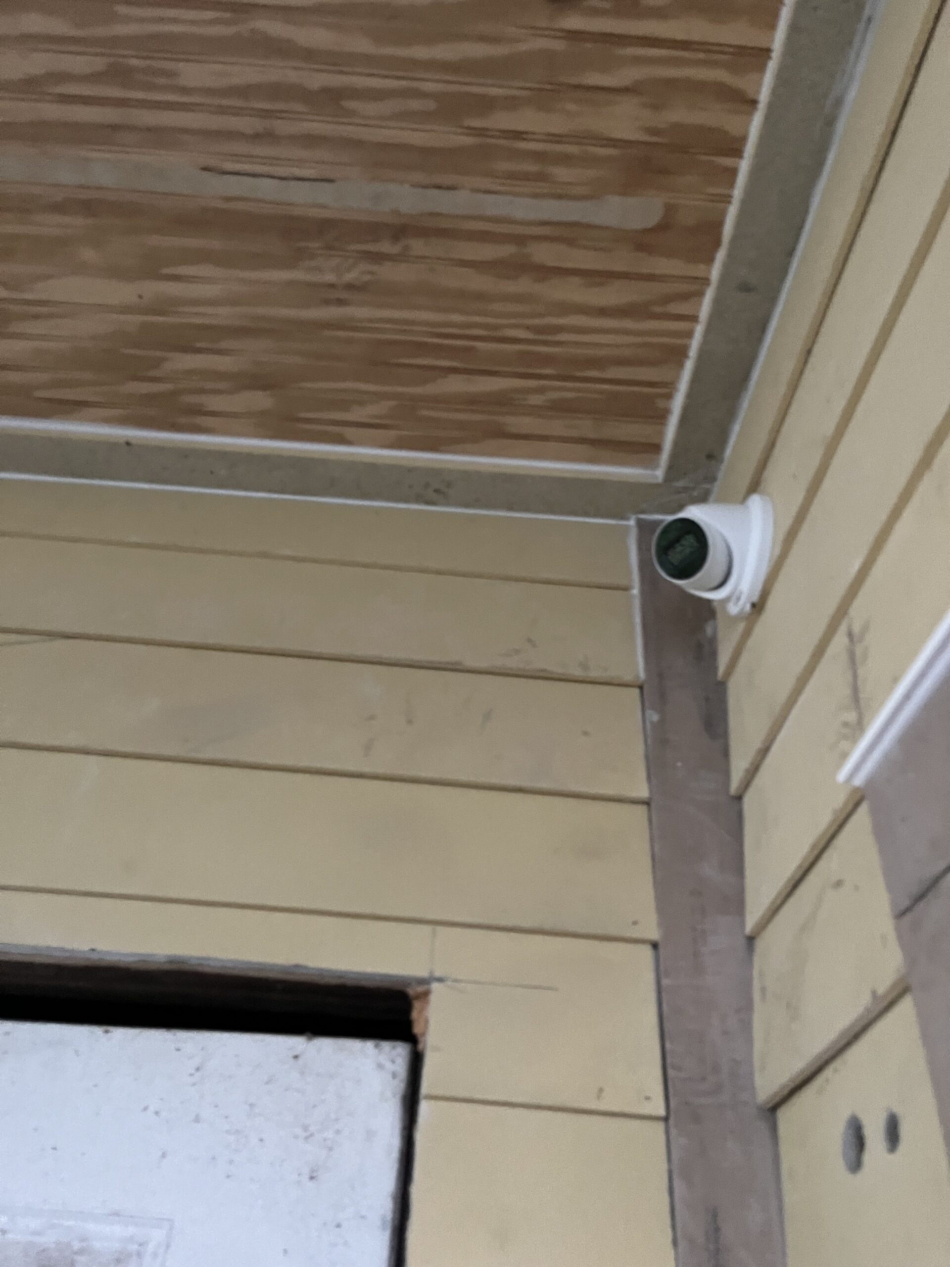 Turret camera fitted under a porch ceiling